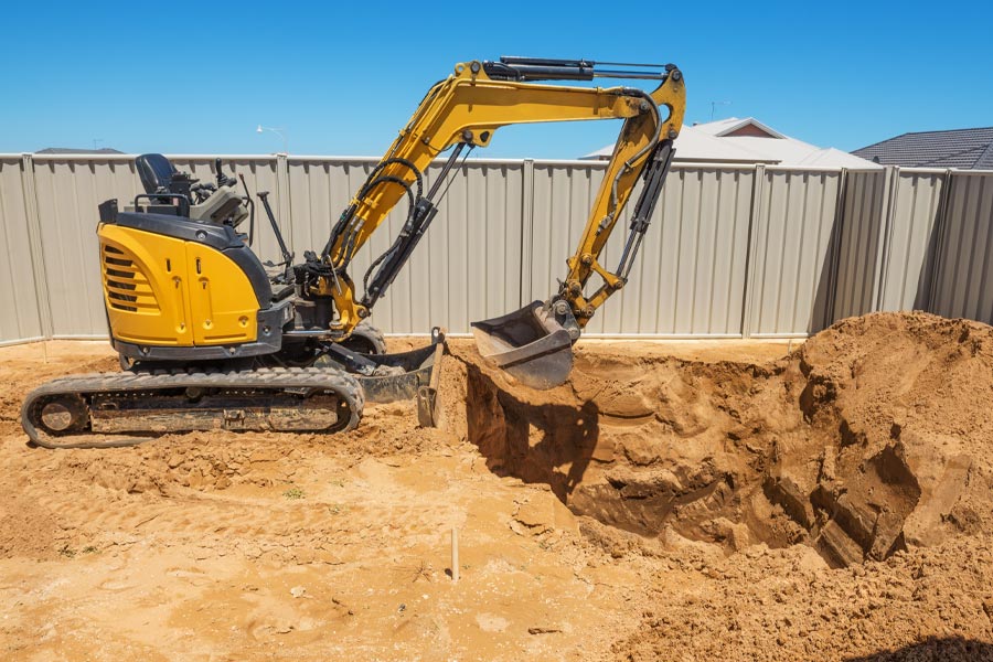 machine-excavating-on-backyard